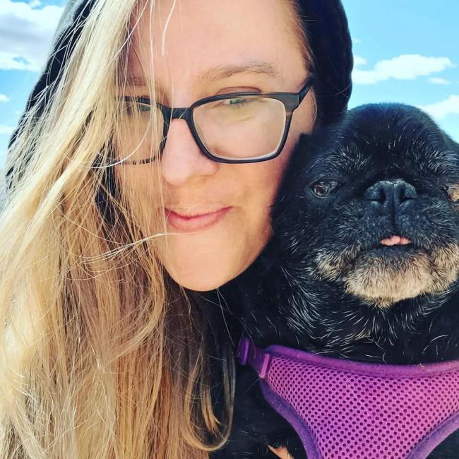 Donna Moore holding her dog